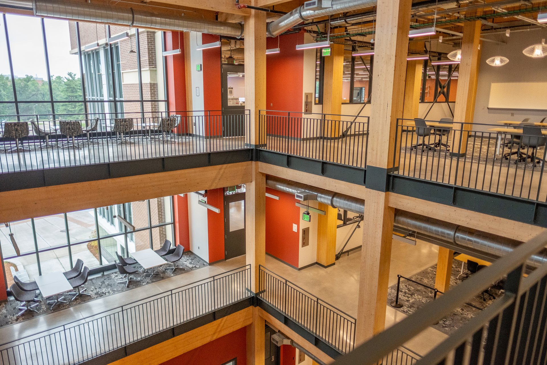 Lobby of the STEM Teaching and Learning Facility at Michigan State University, with mass timber beams and open study spaces